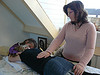 Image of a practitioner performing a reiki energy healing session with hands upon the recipient's back 
