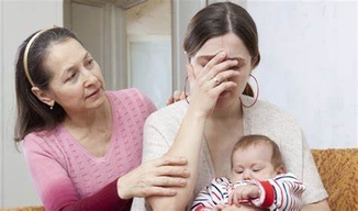 Image of upset mom holding baby 